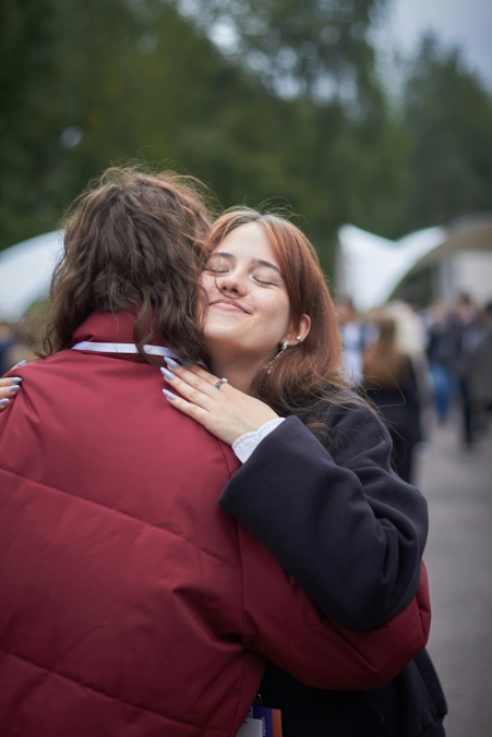 A couple embracing warmly in a natural, unposed moment