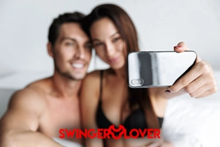 Happy couple posing for their FREE profile on Swinger Lover Dating App