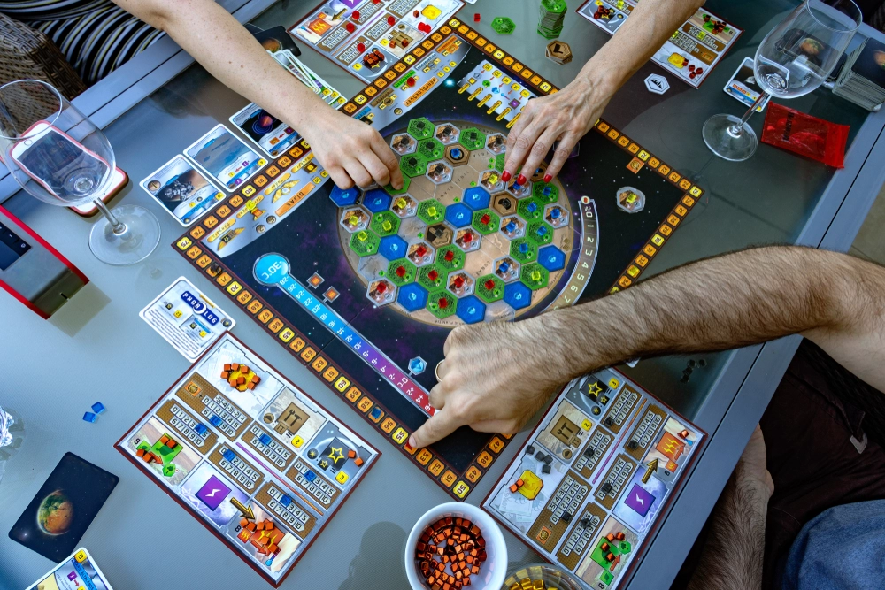 Euro game enthusiasts strategizing over a complex board game