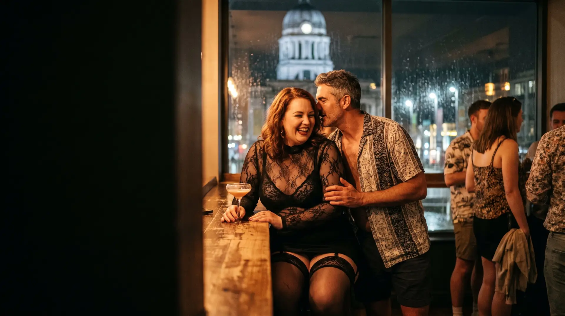A woman in lace laughing at the bar as a man whispers to her, Nottingham's Council House behind