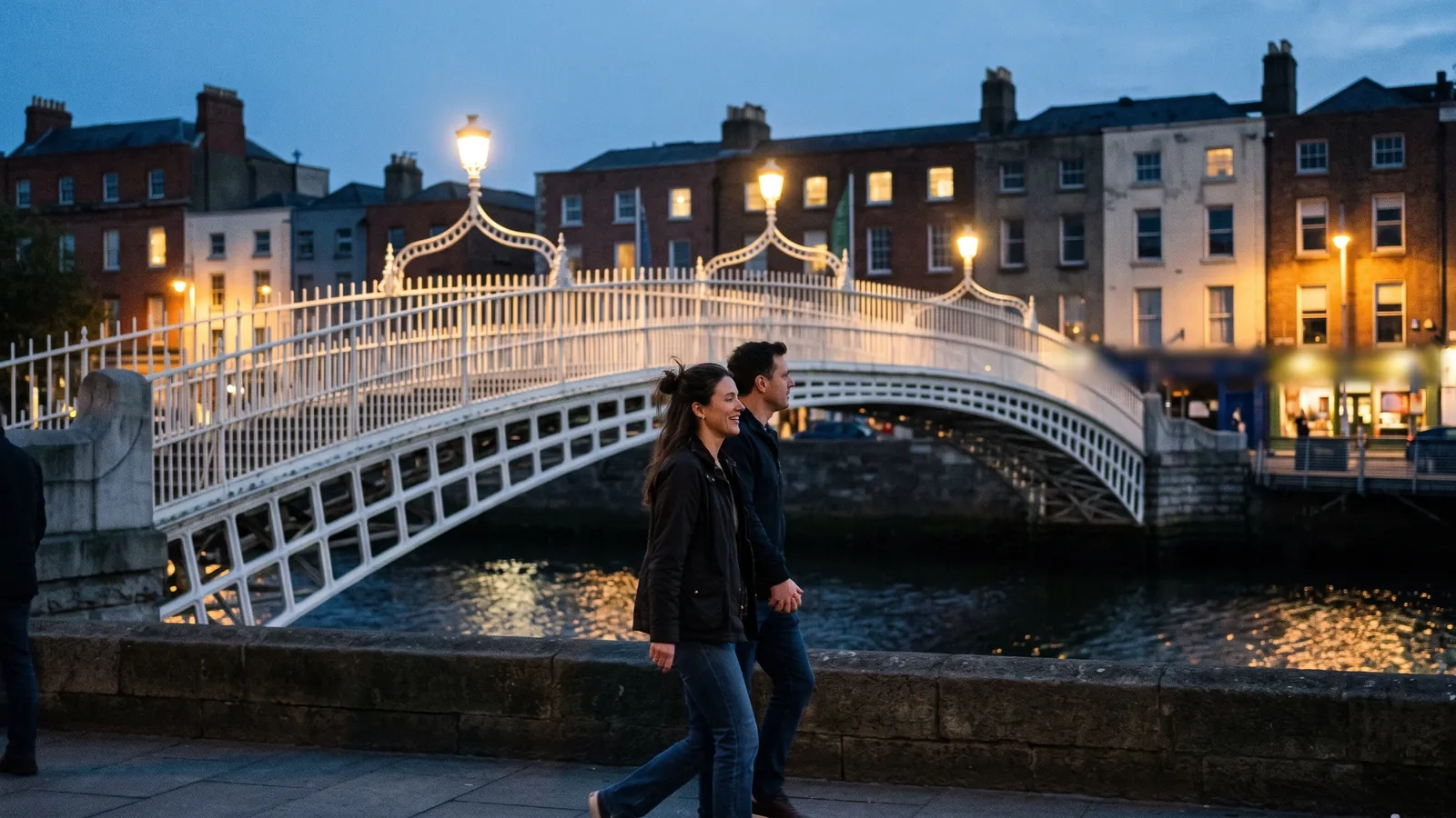A couple walks hand in hand across a white cast-iron footbridge over the Liffey at dusk, the quayside lit up behind them (AI-generated image)
