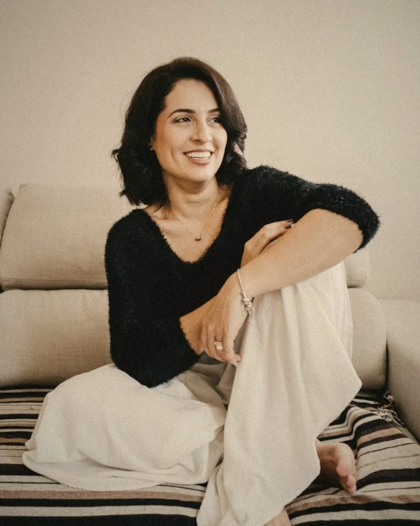 Relaxed woman smiling on a sofa