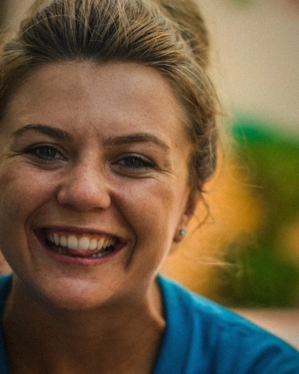 Smiling woman in a blue top
