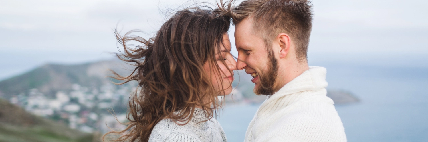 A joyful couple holding hands in San Francisco, showcasing the vibrant dating scene in the city.