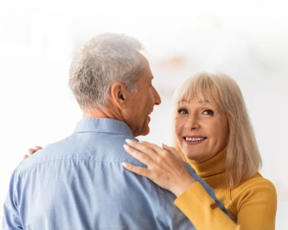 Mature couple smiling warmly