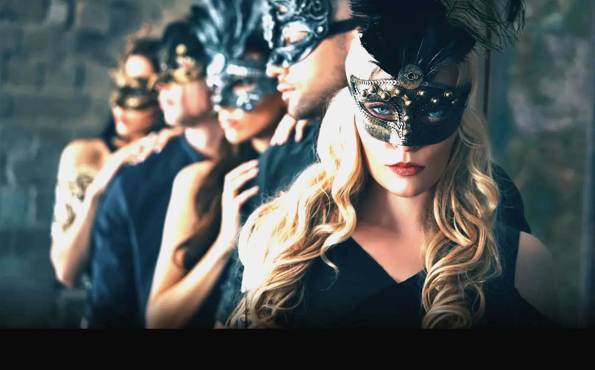 Four people in black masquerade masks standing close together at an evening party, illustrative photo of models