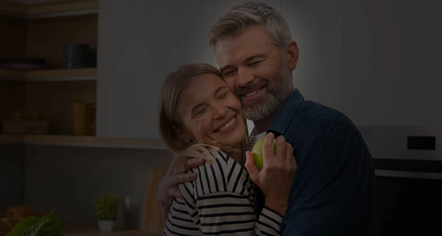 Happy Divorced couple embracing after meeting on Divorce Love Hub dating app