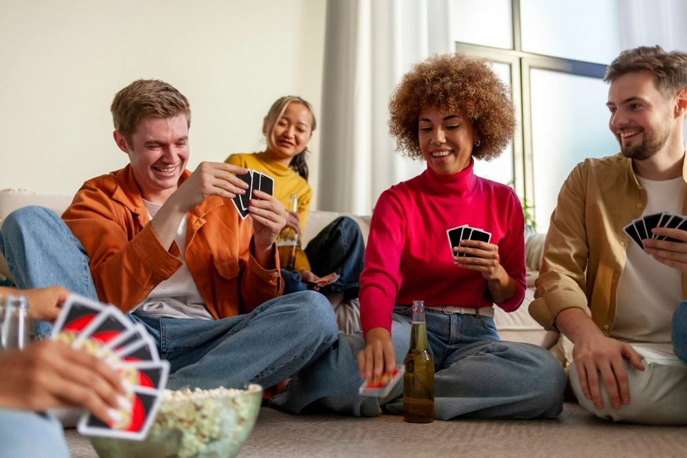 Group of friends laughing during a party game