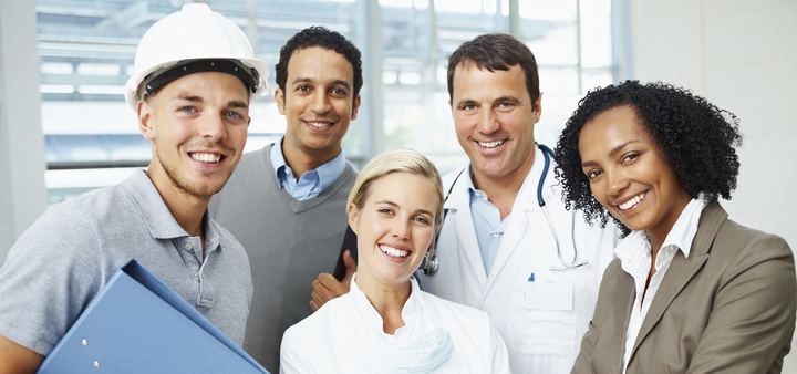 Professionals from medicine, engineering and business standing together