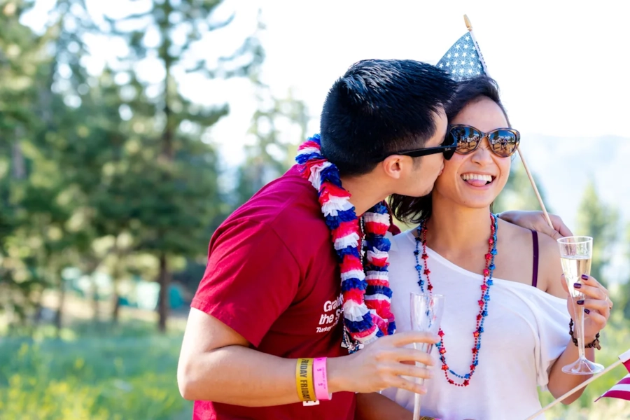 Illustrative photo, not an actual member. A couple celebrating together outdoors with patriotic decorations.
