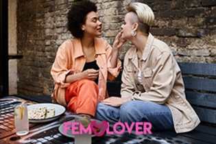 Lesbian couple enjoying a romantic date after meeting on FEM Lover.