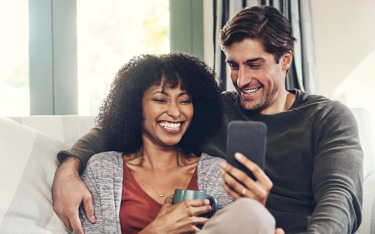 White and Black couple sharing a laugh