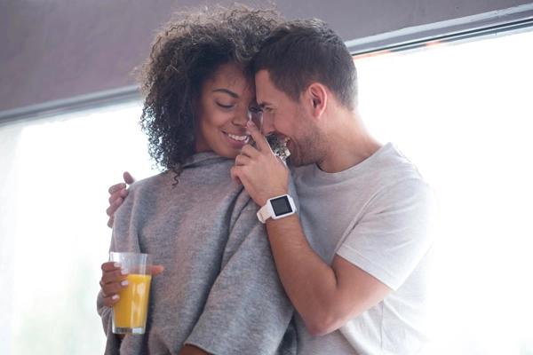 Happy interracial couple laughing together