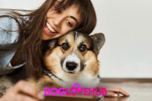 A happy woman smiling while creating her profile with her dog on DogLoveHub.com