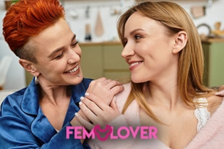 Two women laughing together in a café, symbolising a successful FEM Lover match.