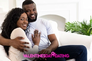 Happy couple smiling on their first date after meeting on Valentines Day Dating.