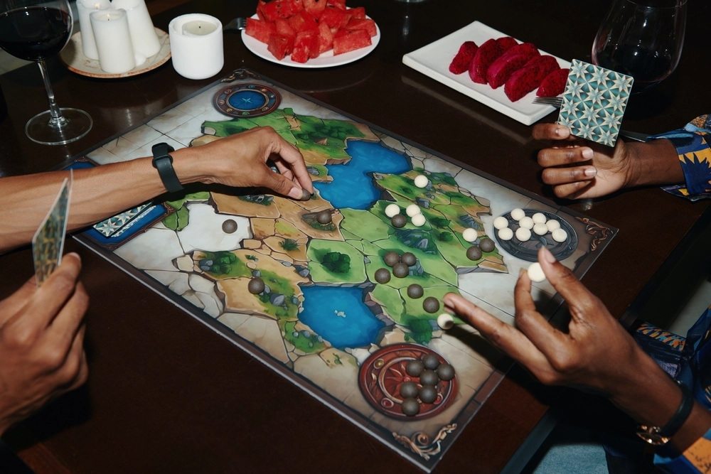 Players demonstrating good board game etiquette at the table