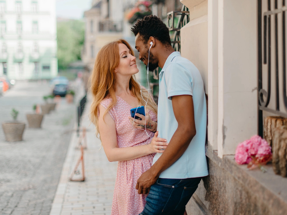 Black and white couple holding each other close