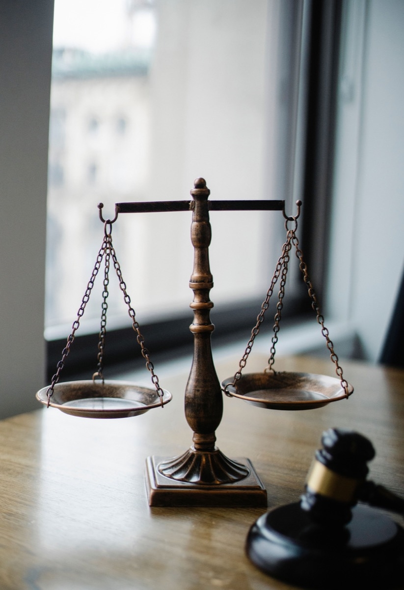 Illustrative photograph of a legal professional reviewing information at a desk