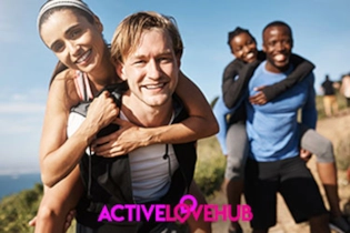 Two happy couples sharing a laugh while taking a break during a scenic mountain hike.
