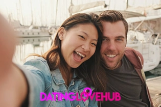 A smiling couple on their first date on Dating Love Hub website.