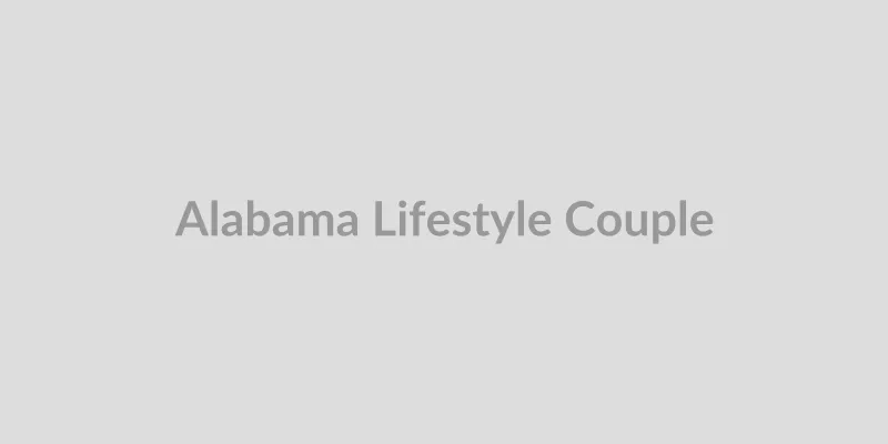 Happy couple holding hands in an Alabama park