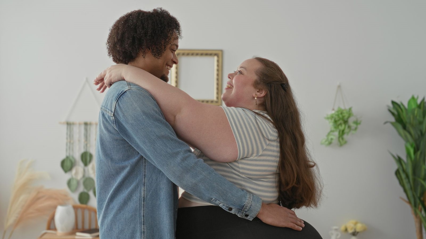 A couple embracing warmly at home