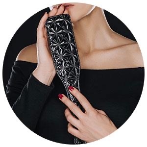 Illustrative close-up fashion image with a paddle