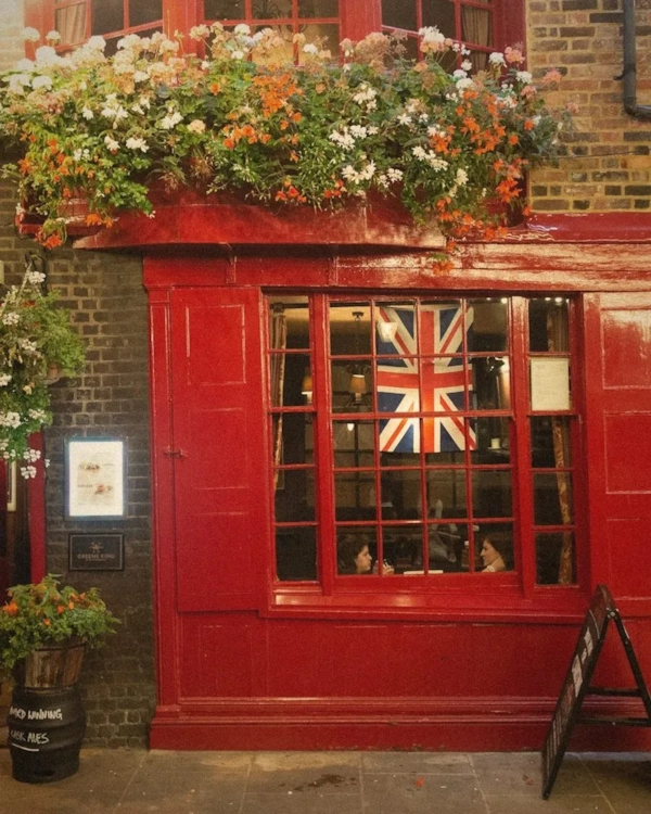 Red British shopfront with a Union Jack in the window