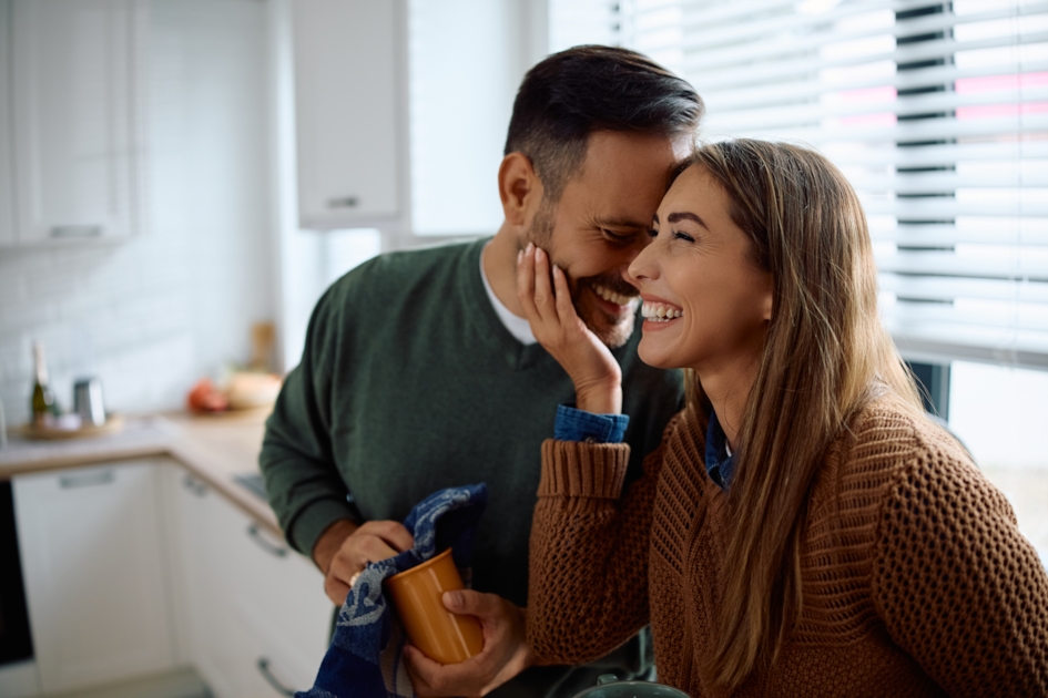 Couple sharing a tender moment together in their kitchen