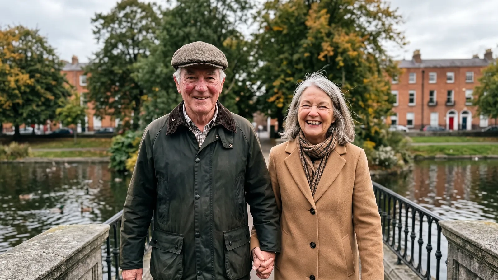 A couple in their late sixties walk hand in hand over a stone bridge across a duck pond in a leafy Dublin park in early autumn (AI-generated image)