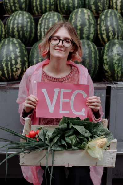 A person checking their phone over a plant-based meal