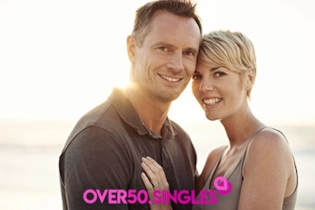 A couple enjoying a sunset walk together, representing the successful outcome of mature dating.