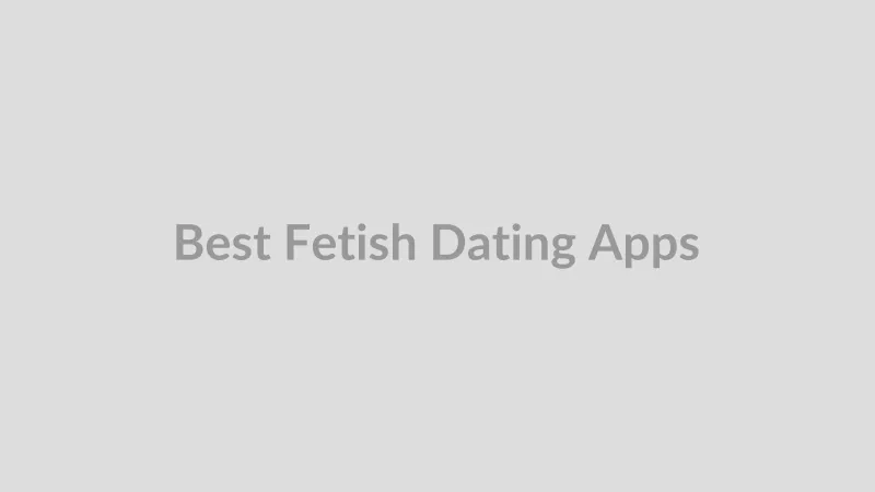 Hand holding a phone with a dating app open