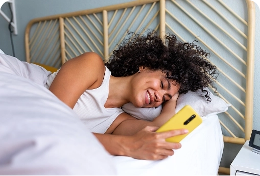 woman smiling on bed