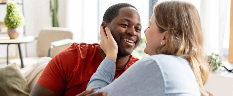 A smiling couple at home together