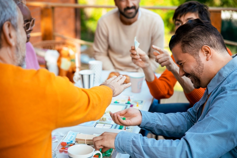 Adult board gamers enjoying a game night together