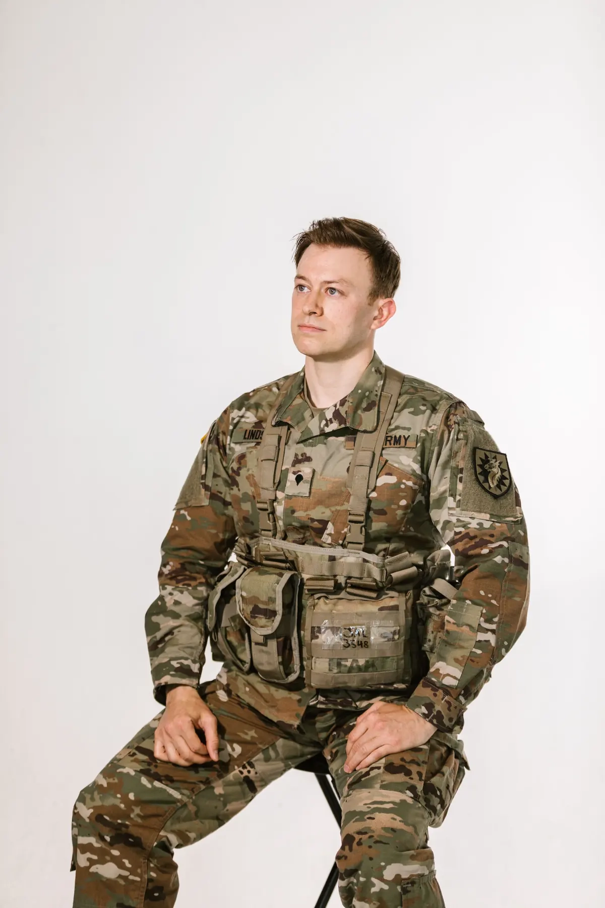 Illustrative portrait of a seated uniformed adult