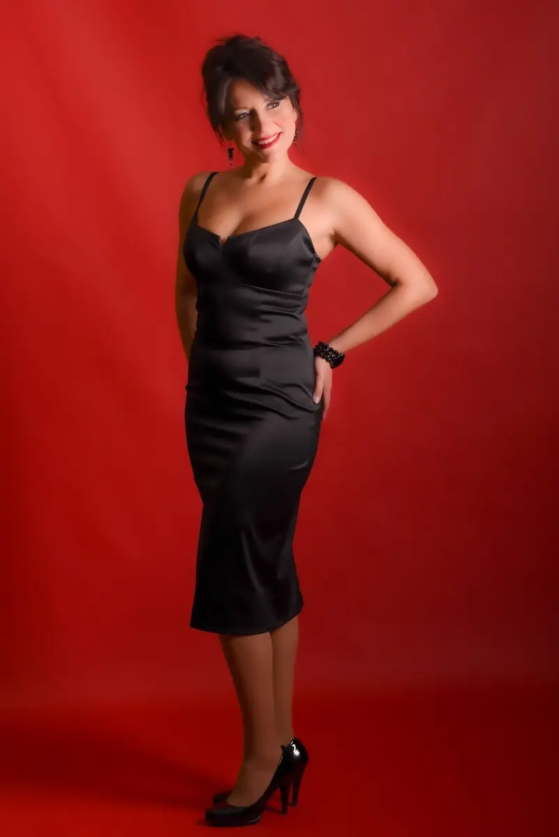 Elegant mature woman wearing a black dress