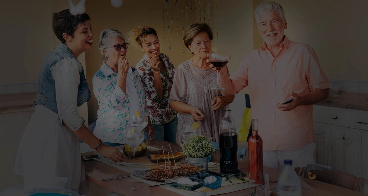 Happy Retired couples enjoying a social party on the Retired Love Hub dating app