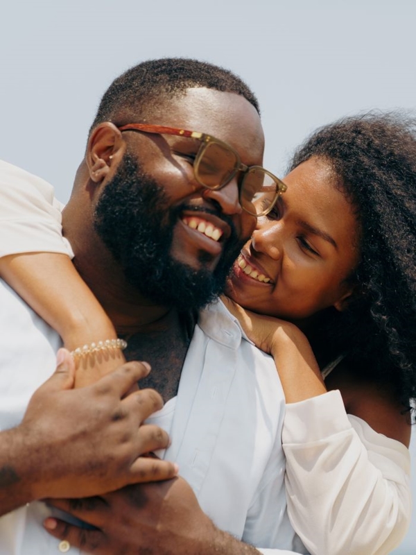 A couple embracing and smiling together