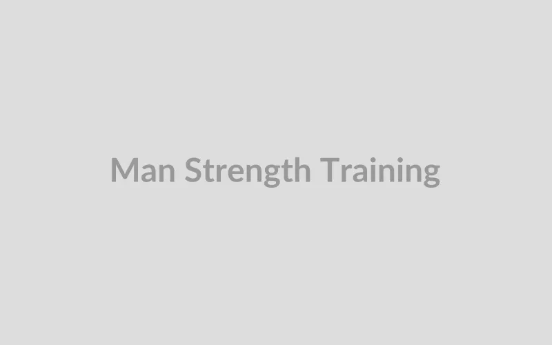 Fit man doing strength training workout in modern gym