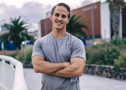 A fit man relaxing outdoors