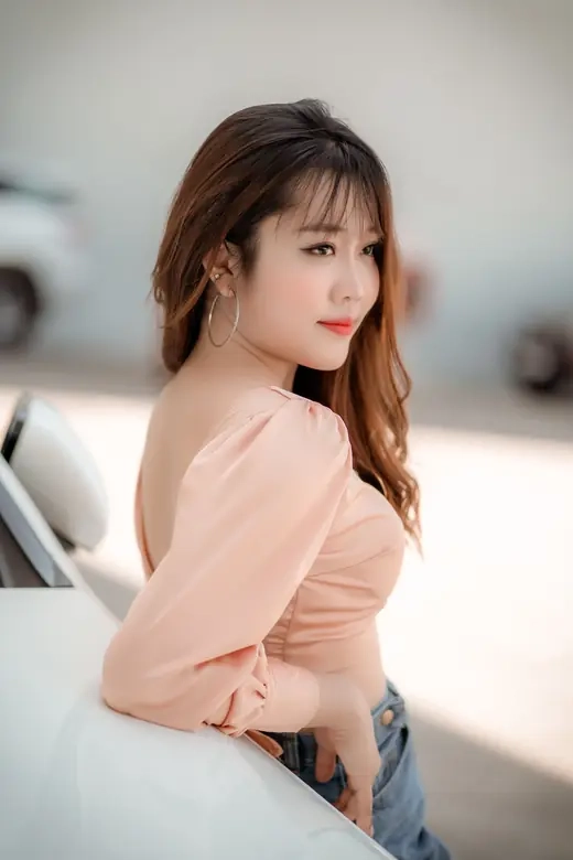 A woman glancing back over her shoulder on a city street