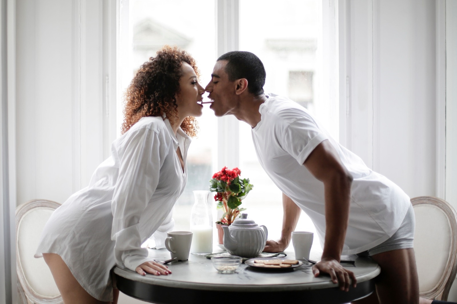 Illustrative stock photo of two adults sharing breakfast at a table. Does not depict real members.
