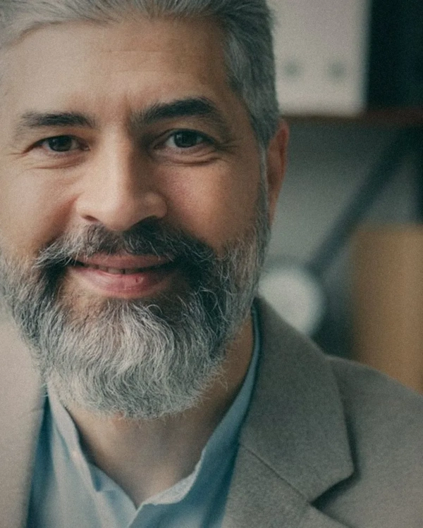 Smiling man with a grey beard