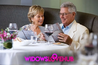 Mature couple enjoying a romantic dinner after meeting online on Widows Love Hub