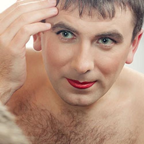 crossdresser looking at makeup