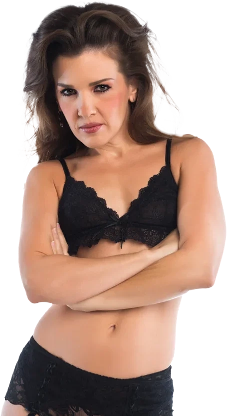 A dark-haired woman in her forties in black lace underwear, arms folded, looking at the camera