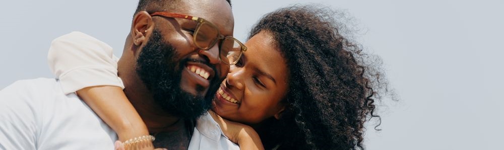A couple embracing and smiling together